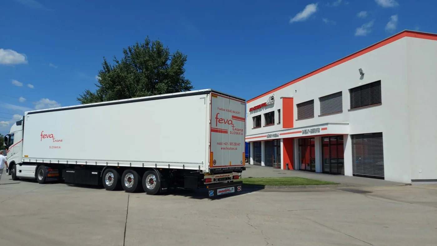 Fevatrans truck outside a building
